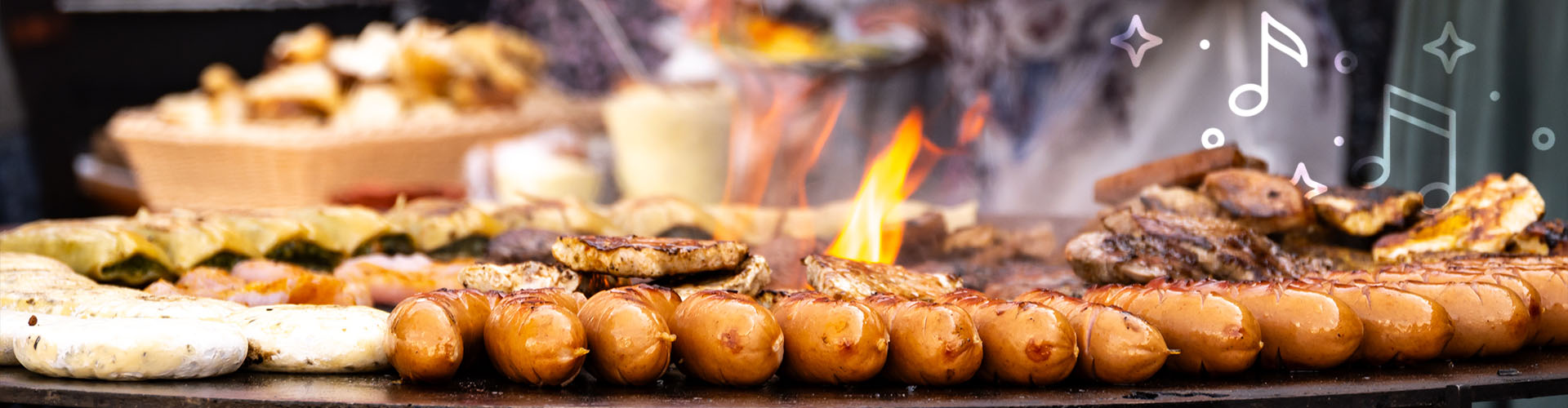 Würstchen auf Fassgrill bei einem Firmengrillfest